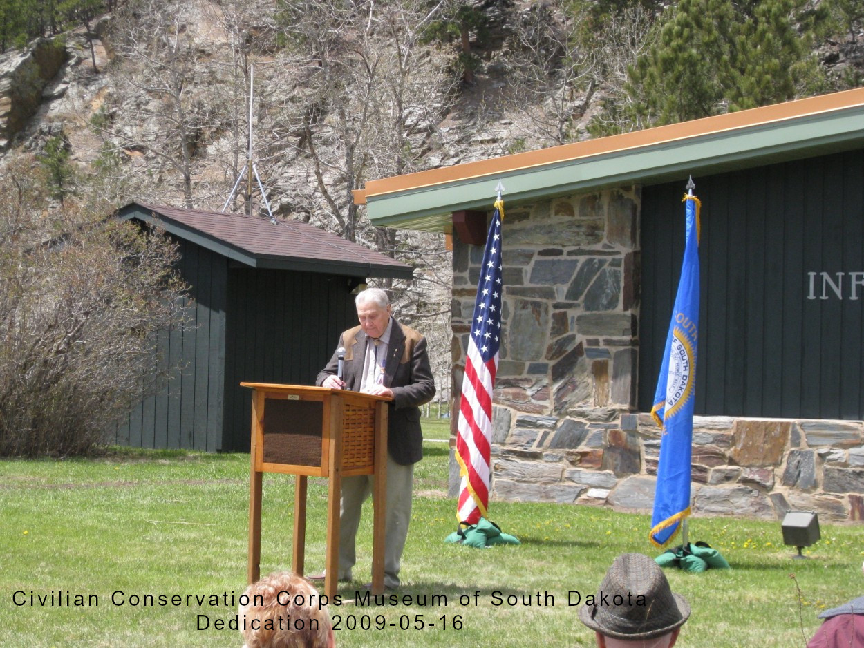 Jay Hendrickson with flags in the background