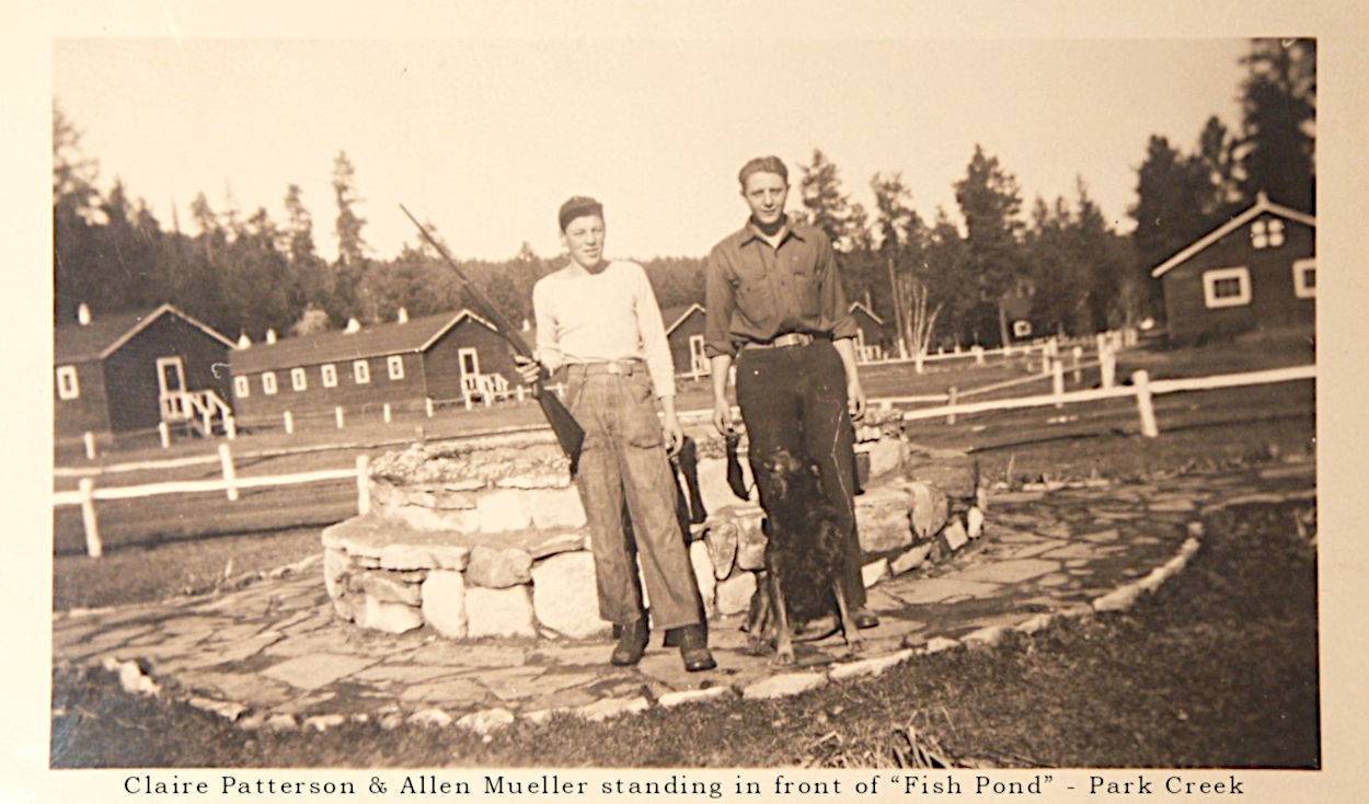 Claire Patterson and Allen Mueller in front of fish pond
