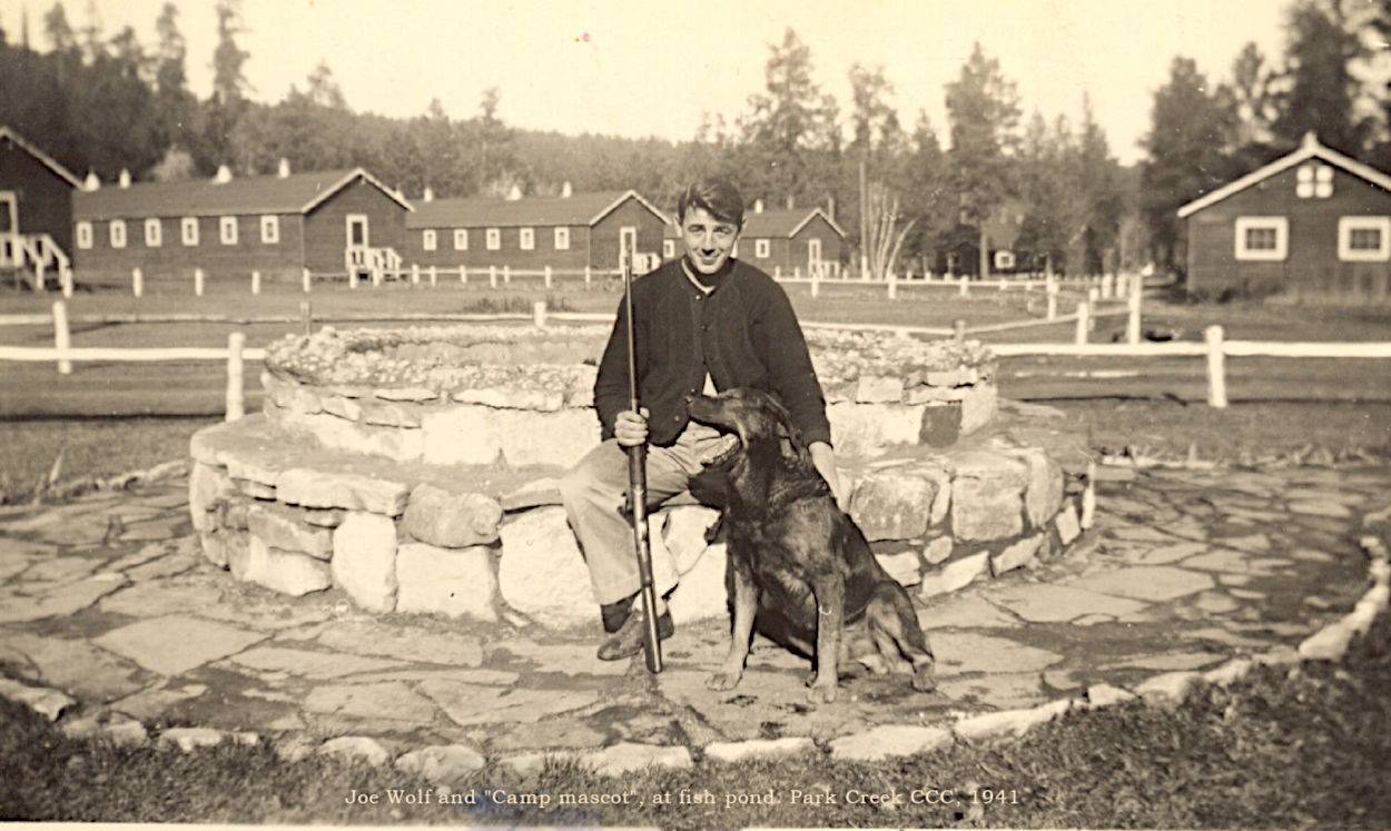 Joe and mascot at fish pond
