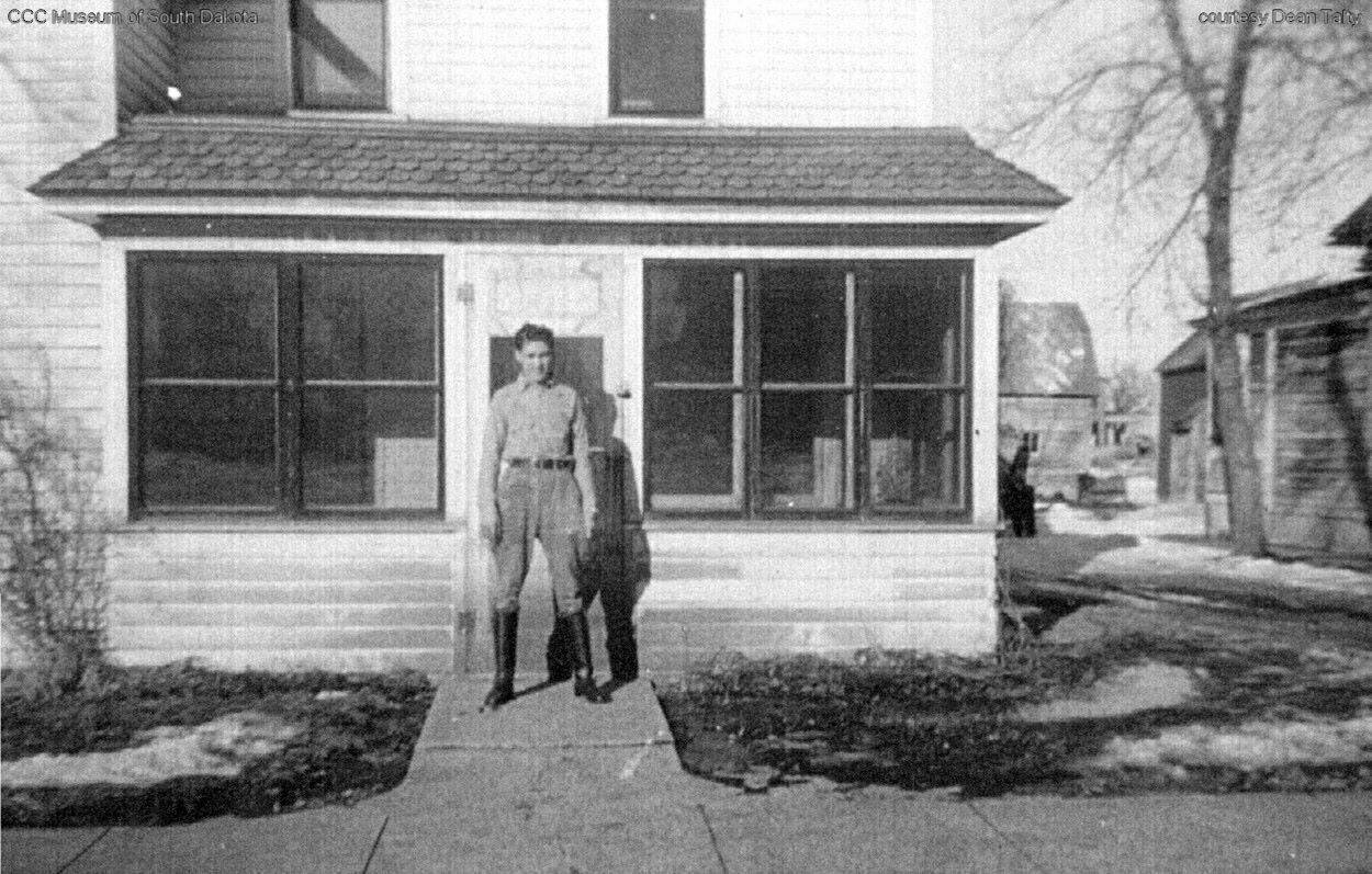 Man in Front of House