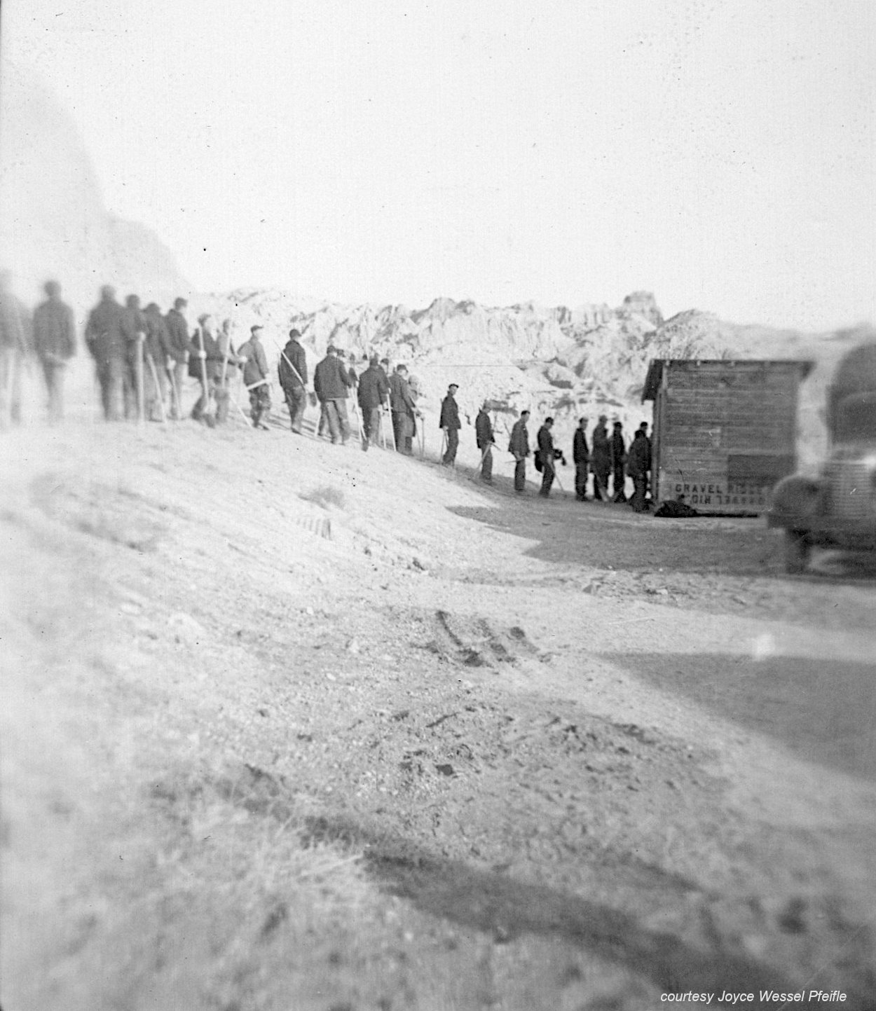 CCC men lined up by building