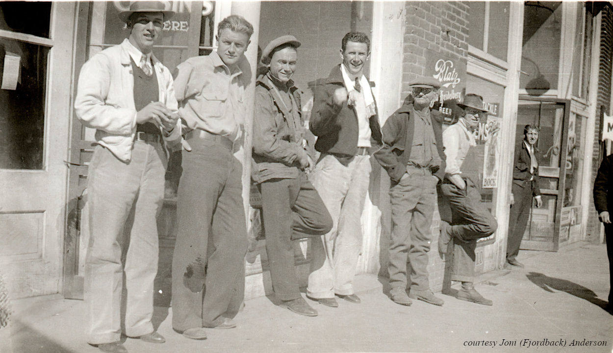 Several men on the sidewalk