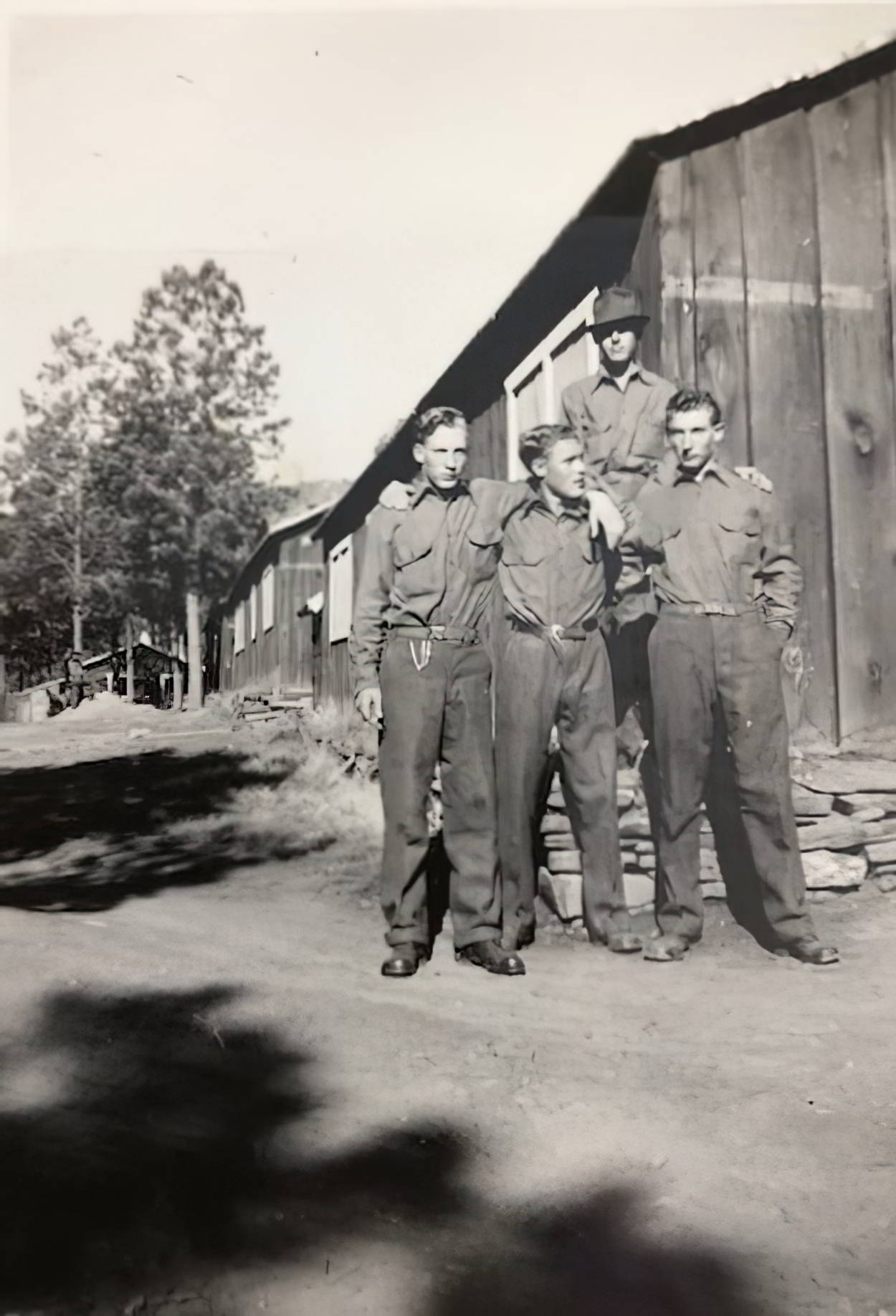 George Butenschoen, Marlen Buttke, Oscar Butenschoen in front, man on top unidentified