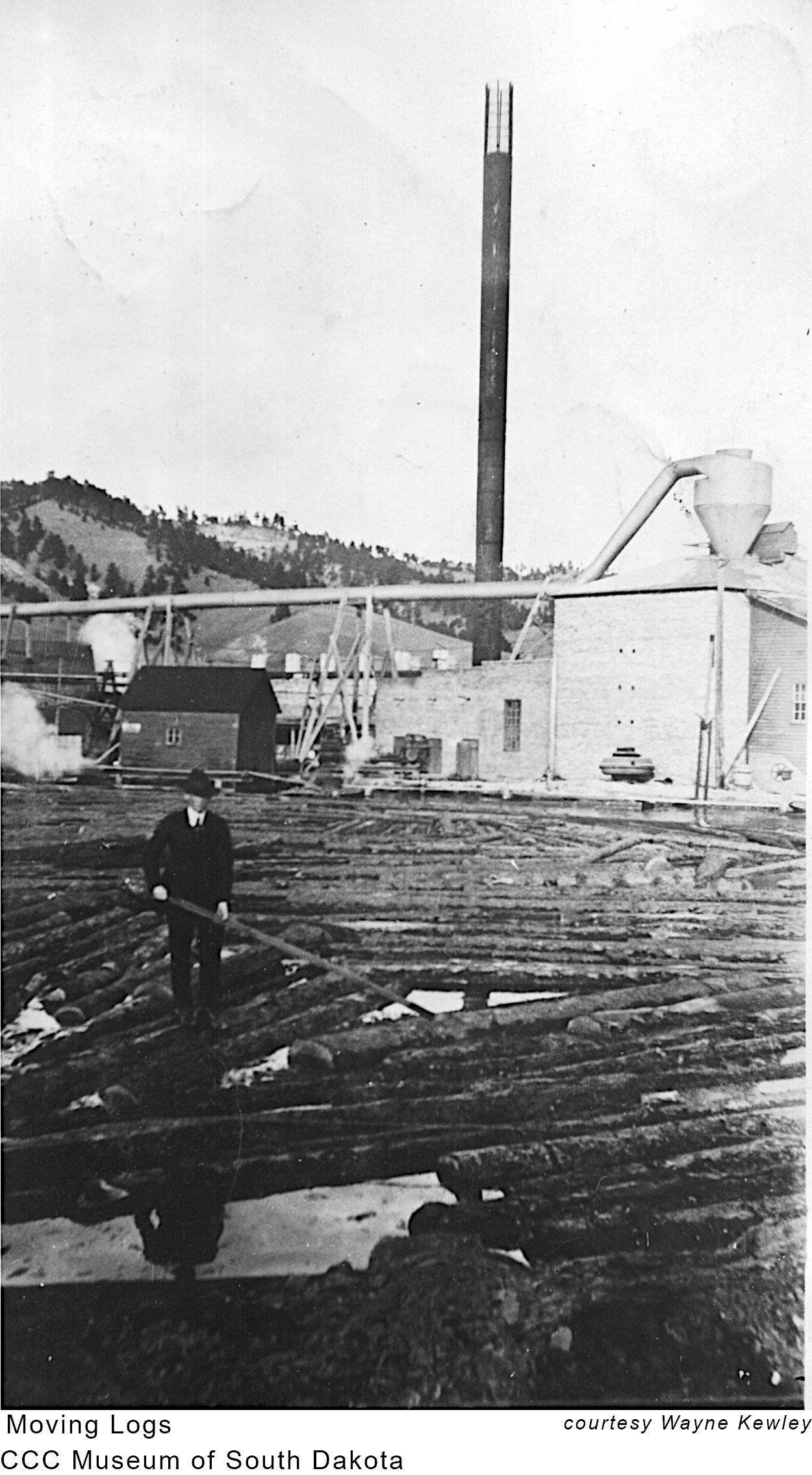 CCC Man Moving Logs