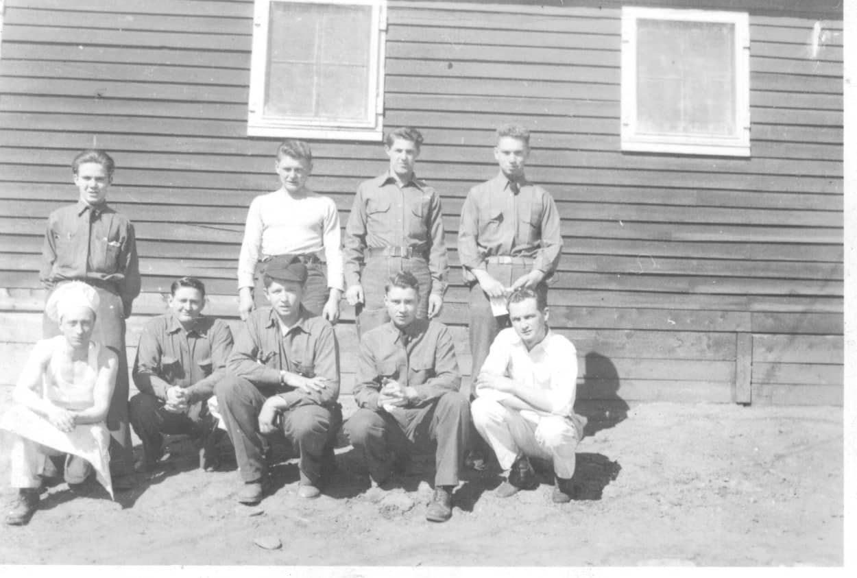 men in front of barracks