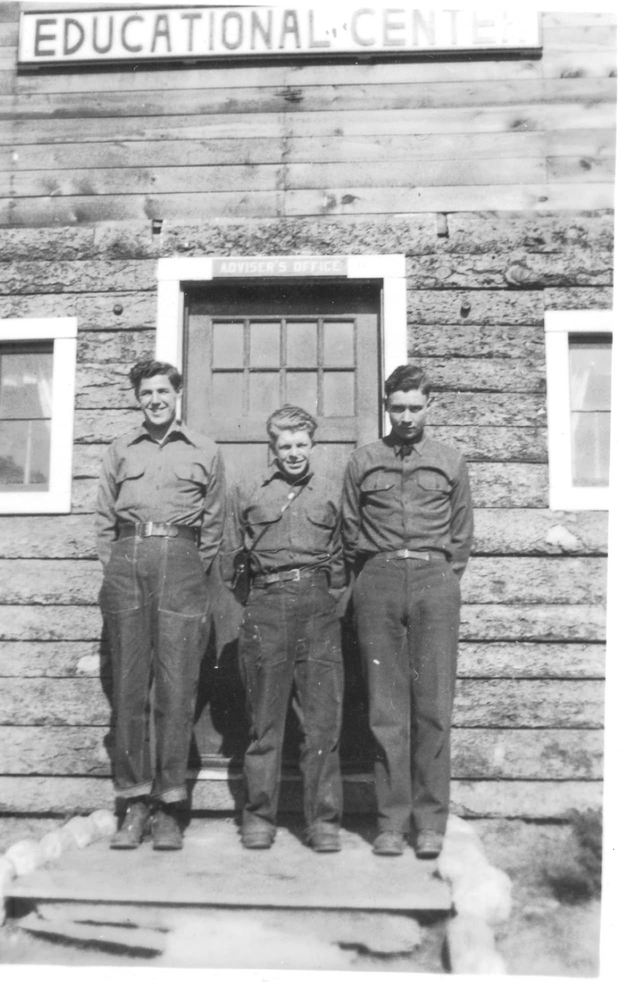 men in front of ed. Center