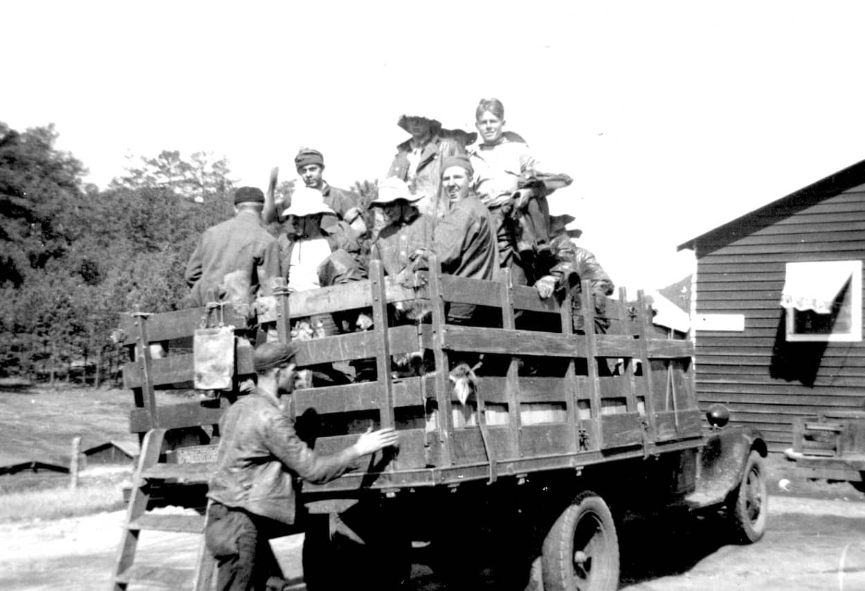 men in truck, returning after fire fighting