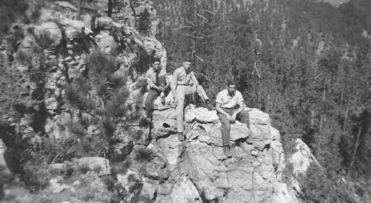 men on rocks in Hills
