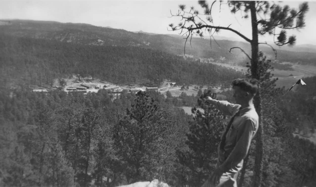 Bob Murphy pointing to Camp Lightning Creek, 791. Harney in distance